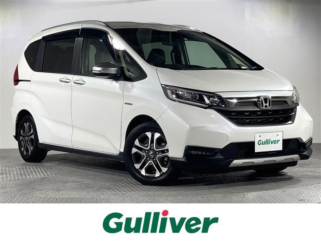 沖縄県の中古車ならフリードハイブリッド ハイブリッド・クロスターホンダセンシング　純正ＳＤナビ／バックカメラ／ビルトインＥＴＣ／ホンダセンシング／衝突軽減ブレーキ／レーンキープアシスト／アダプティブクルーズコントロール／両側パワースライドドア／ハーフレザーシート／ＬＥＤヘッドライト